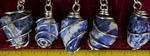 Sodalite stones wire wrapped as pendants on necklaces. Sodalite is a blue stone that often has streaks of white, grey or sometimes streaks of clear quartz